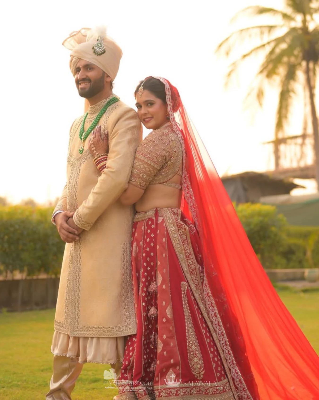 Classic groom pagdi styled with a red ceremonial stole for Ramnagar